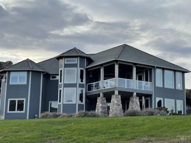 2655 13th St, Clarkston, WA 99403 - back of property with a lawn, a balcony, and a shingled roof