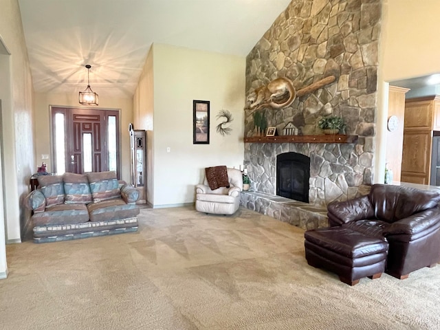 living room with carpet flooring, a stone fireplace, and high vaulted ceiling