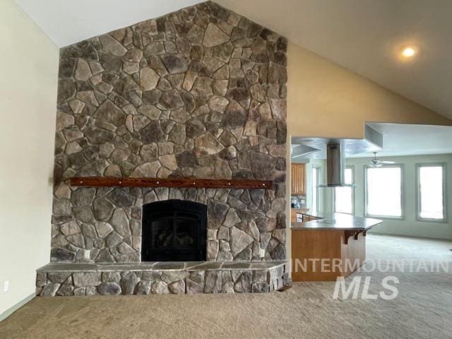 2655 13th St, Clarkston, WA 99403 - unfurnished living room with carpet floors, lofted ceiling, a fireplace, and ceiling fan