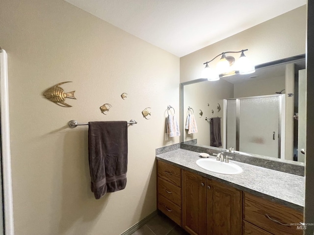 2655 13th St, Clarkston, WA 99403 - bathroom with vanity, a stall shower, and tile patterned flooring