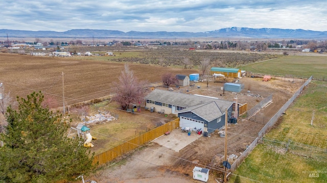 birds eye view of property with a mountain view and a rural view