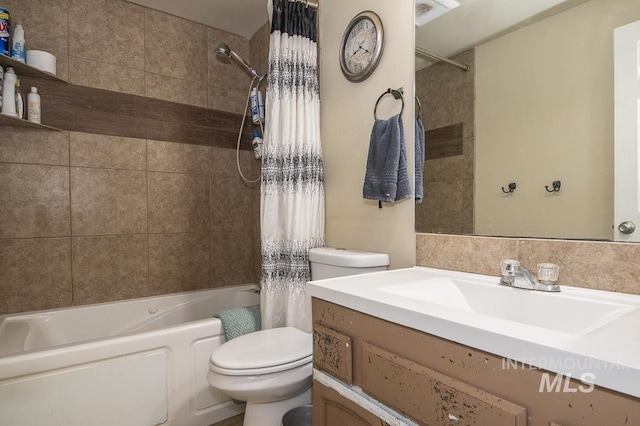 full bathroom with vanity, shower / bathtub combination with curtain, and toilet