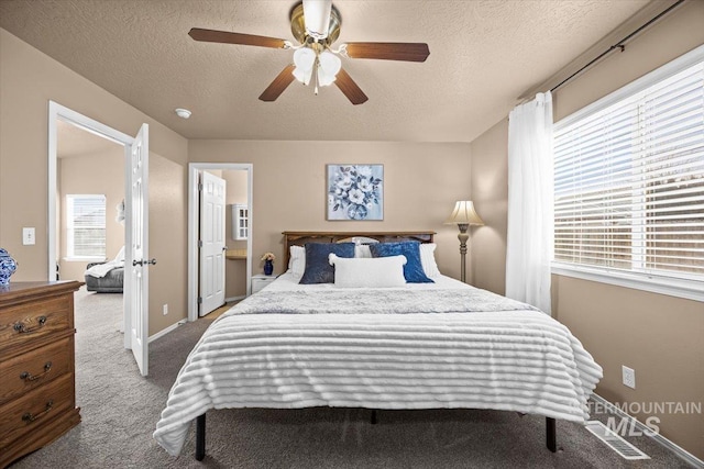16702 Frisco Ave, Caldwell, ID 83607 - carpeted bedroom featuring a textured ceiling, ceiling fan, and baseboards