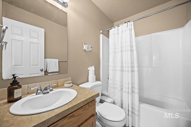 16702 Frisco Ave, Caldwell, ID 83607 - full bathroom with toilet, a textured ceiling, shower / bath combo with shower curtain, and vanity
