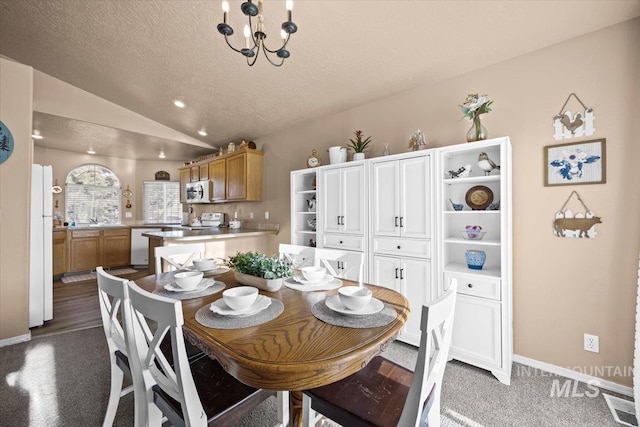 16702 Frisco Ave, Caldwell, ID 83607 - carpeted dining space featuring lofted ceiling, a textured ceiling, a chandelier, baseboards, and recessed lighting