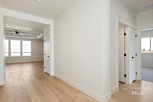 corridor with light wood-type flooring