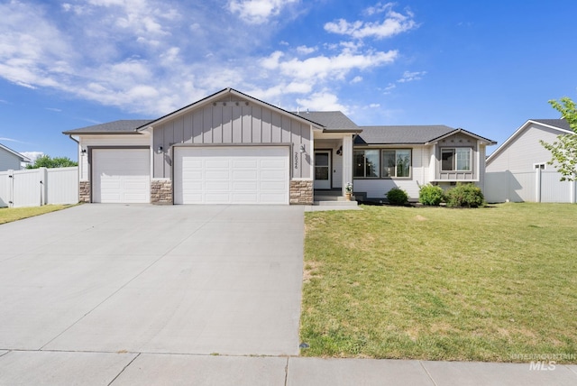 2026 Kelly Dr, Payette, ID 83661 - ranch-style home featuring board and batten siding, a garage, driveway, stone siding, and a gate