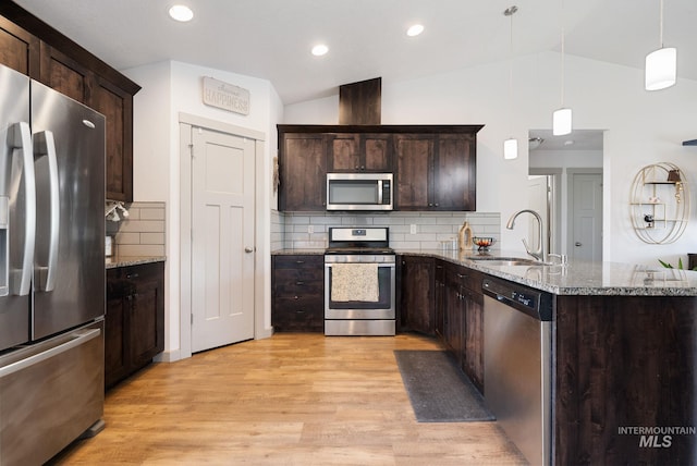 2026 Kelly Dr, Payette, ID 83661 - kitchen featuring appliances with stainless steel finishes, light wood finished floors, dark brown cabinets, lofted ceiling, and recessed lighting