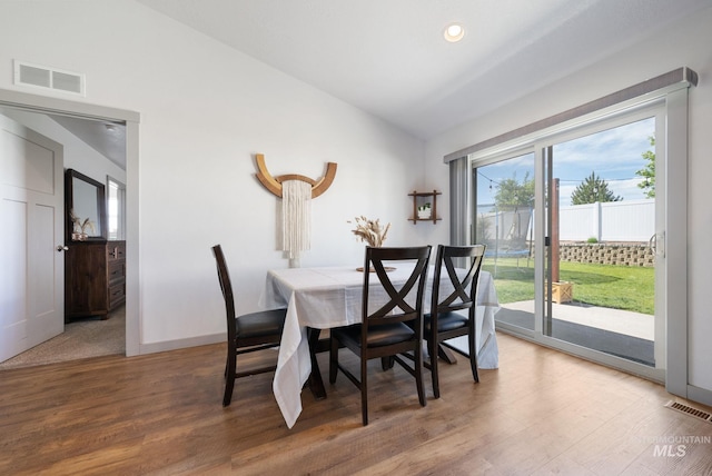 2026 Kelly Dr, Payette, ID 83661 - dining space featuring wood finished floors, vaulted ceiling, baseboards, and recessed lighting