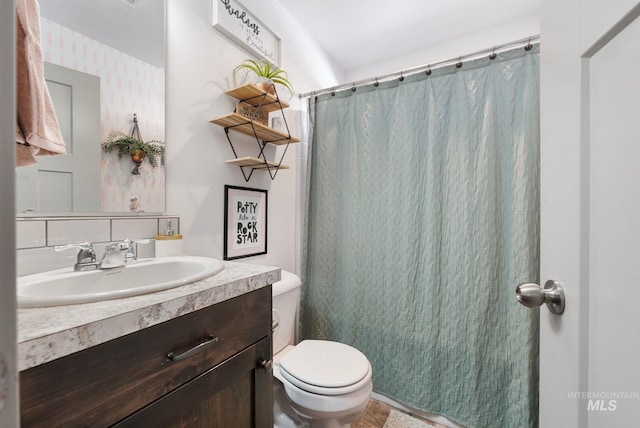2026 Kelly Dr, Payette, ID 83661 - full bath featuring vanity, toilet, and a shower with shower curtain