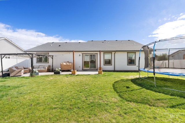2026 Kelly Dr, Payette, ID 83661 - rear view of property with a trampoline, outdoor lounge area, and a patio area