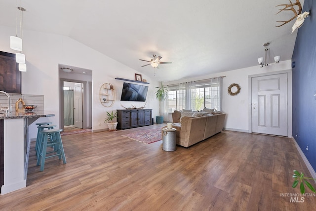 2026 Kelly Dr, Payette, ID 83661 - living area with vaulted ceiling, ceiling fan, wood finished floors, and baseboards