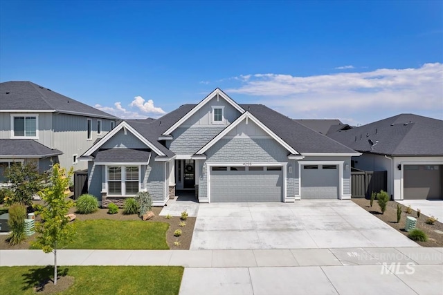 4256 N Sunny Side Ave, Meridian, ID 83646 - craftsman house with an attached garage, driveway, a front yard, and stone siding