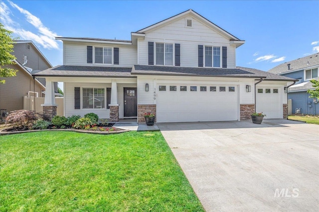 1499 E Sicily St, Meridian, ID 83642 - view of front of home with stone siding, a front lawn, concrete driveway, and a garage