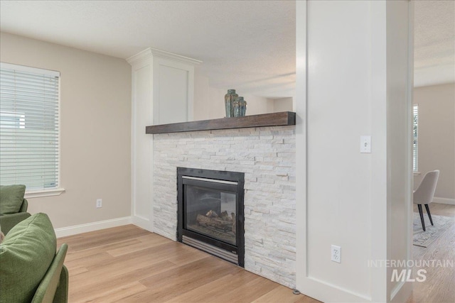 1499 E Sicily St, Meridian, ID 83642 - living area with light wood finished floors and a fireplace