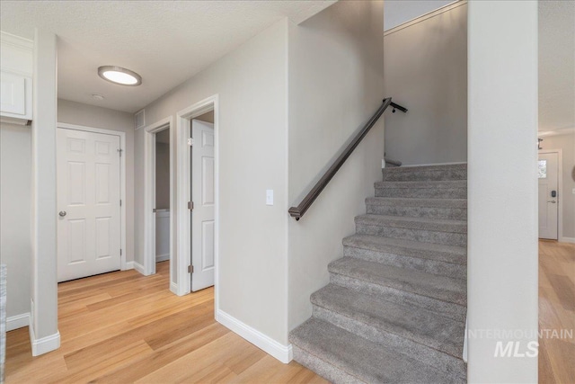 1499 E Sicily St, Meridian, ID 83642 - stairway featuring wood finished floors and baseboards