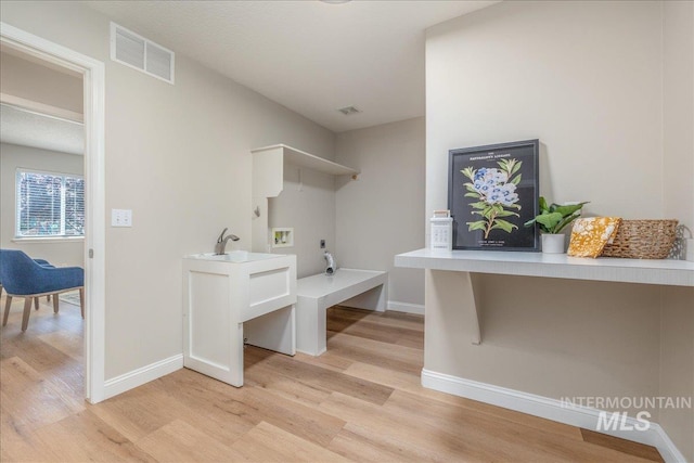 1499 E Sicily St, Meridian, ID 83642 - laundry room with washer hookup, light wood-type flooring, and hookup for an electric dryer