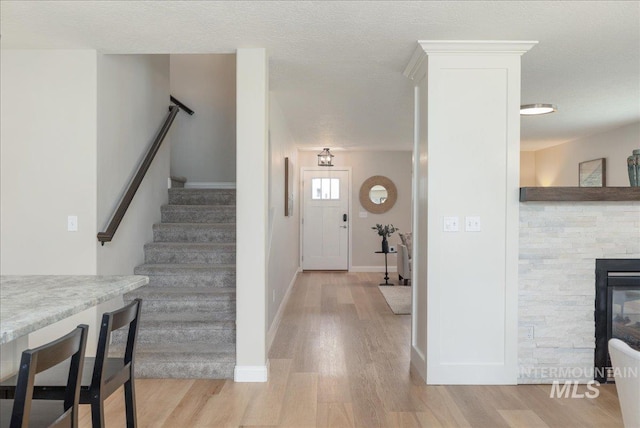 1499 E Sicily St, Meridian, ID 83642 - entrance foyer featuring light wood finished floors and stairway