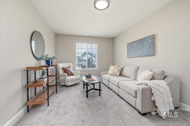 1499 E Sicily St, Meridian, ID 83642 - carpeted living room featuring baseboards and a textured ceiling