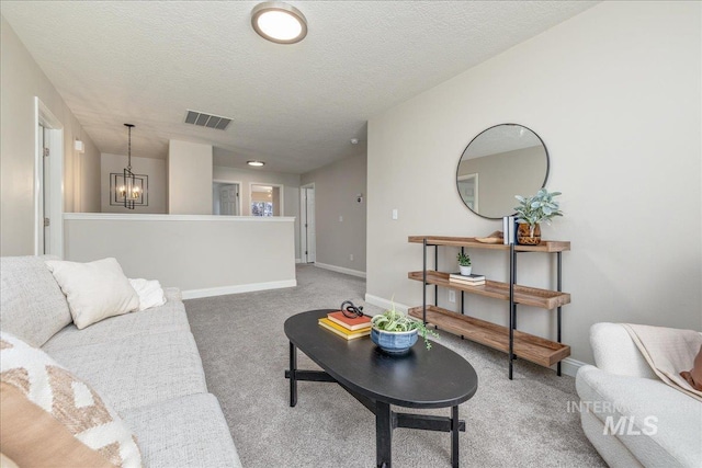 1499 E Sicily St, Meridian, ID 83642 - living area with light carpet, a chandelier, and a textured ceiling