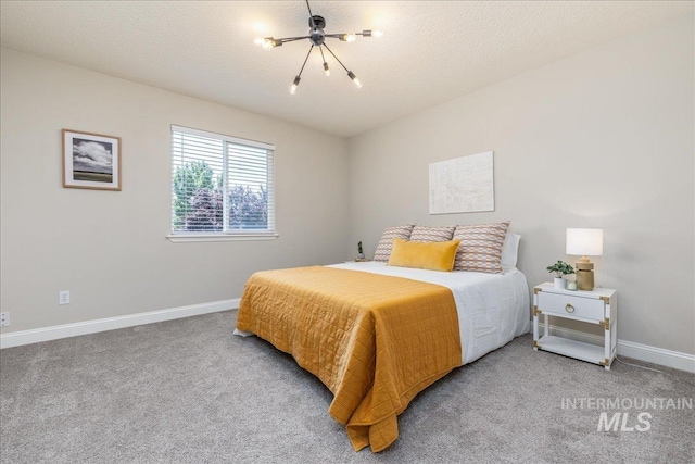 1499 E Sicily St, Meridian, ID 83642 - carpeted bedroom with baseboards and a chandelier