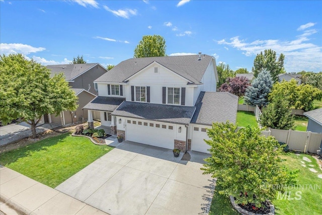 1499 E Sicily St, Meridian, ID 83642 - traditional-style house with stone siding, a garage, driveway, and a shingled roof