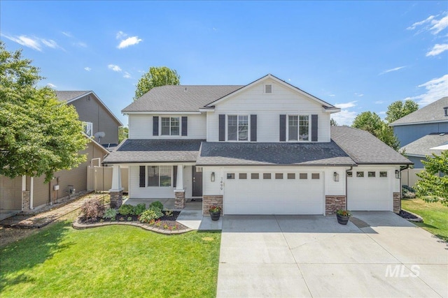 1499 E Sicily St, Meridian, ID 83642 - view of front of home with driveway, roof with shingles, stone siding, and an attached garage