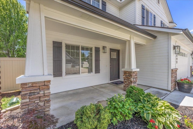 1499 E Sicily St, Meridian, ID 83642 - view of exterior entry with a porch, stone siding, and a garage