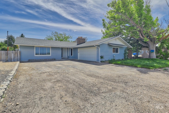 ranch-style house featuring a garage