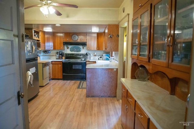 kitchen with black range with electric cooktop, stainless steel refrigerator, light hardwood / wood-style flooring, and ceiling fan