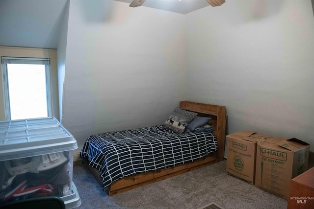 bedroom featuring ceiling fan and carpet flooring