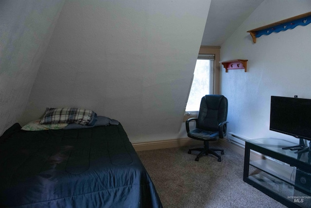 bedroom with lofted ceiling and carpet