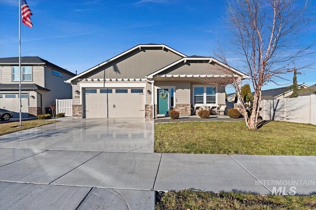 view of front of home with a garage and a front yard