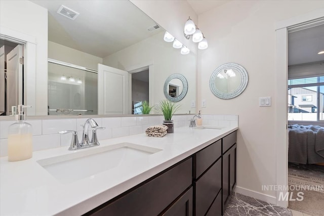 bathroom with vanity and decorative backsplash