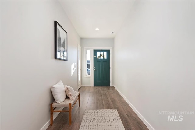 doorway with dark hardwood / wood-style floors