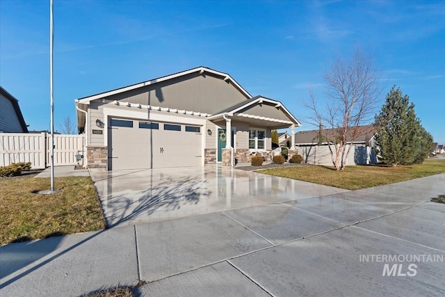 view of front of property with a garage and a front yard