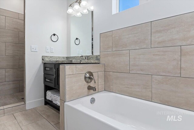 bathroom with vanity, plus walk in shower, and tile patterned floors