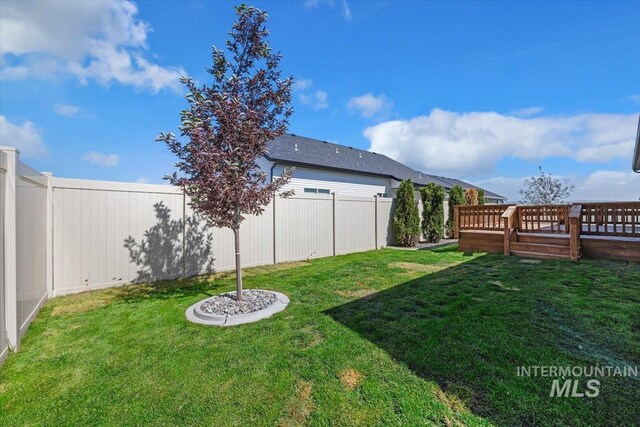 view of yard featuring a wooden deck