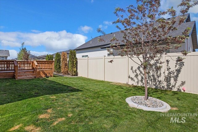 view of yard with a deck