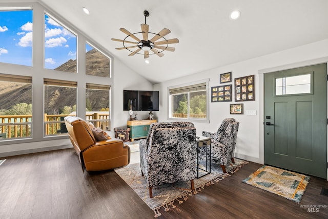 living room featuring high vaulted ceiling, dark hardwood / wood-style floors, and ceiling fan