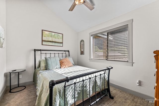 bedroom with dark colored carpet, vaulted ceiling, and ceiling fan