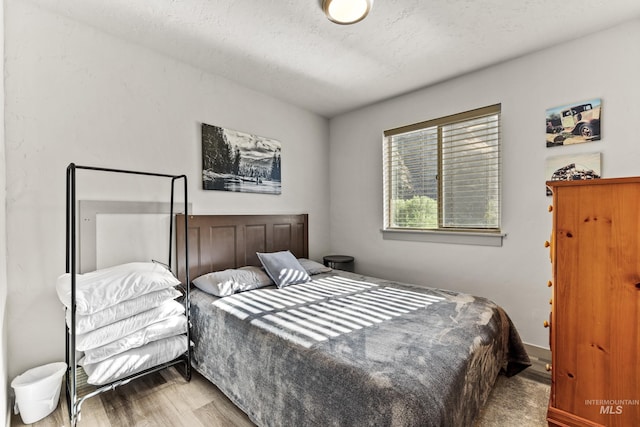 bedroom featuring hardwood / wood-style floors