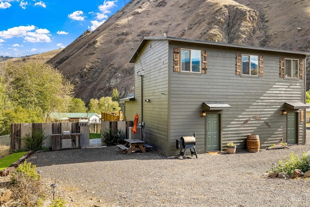 back of property featuring a mountain view