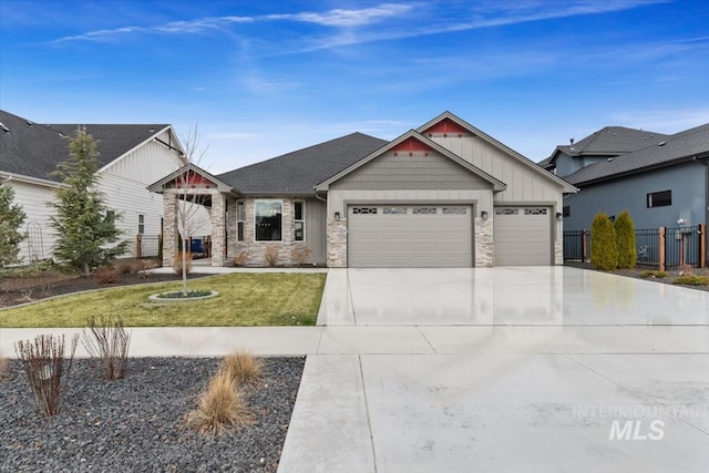 8042 W Decathlon, Eagle, ID 83616 - craftsman inspired home featuring stone siding, driveway, a garage, and fence