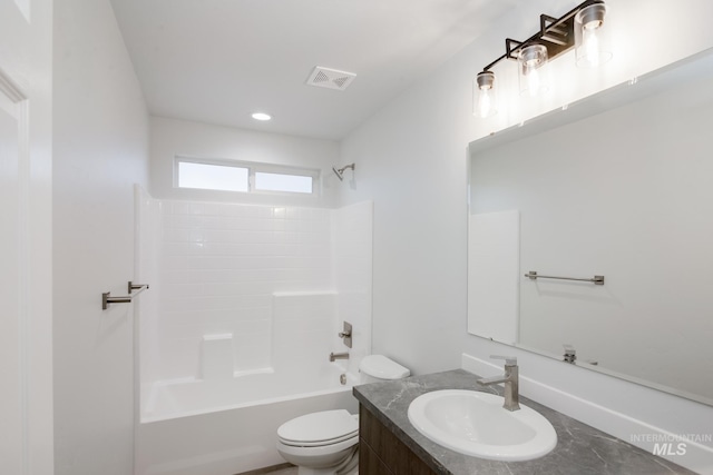 full bathroom featuring toilet, vanity, and  shower combination