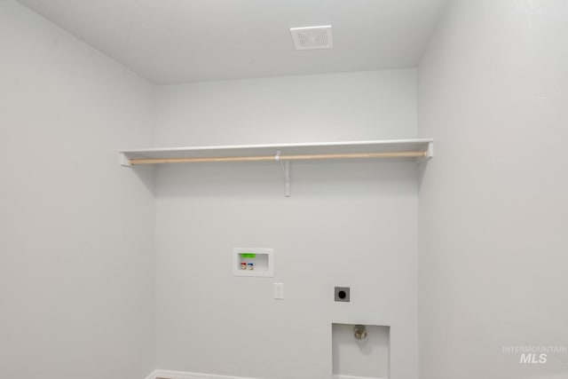 laundry area with washer hookup and electric dryer hookup