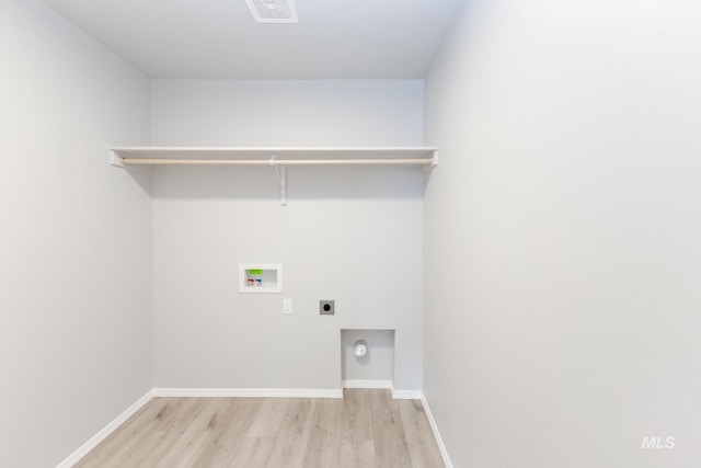277 N Coltsfoot Ave, Kuna, ID 83634 - clothes washing area with visible vents, light wood finished floors, hookup for an electric dryer, laundry area, and washer hookup