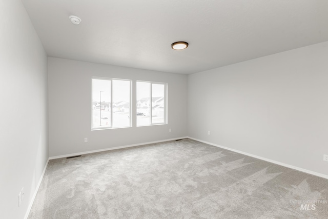 277 N Coltsfoot Ave, Kuna, ID 83634 - carpeted spare room with baseboards and visible vents