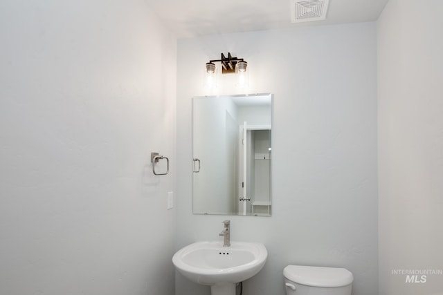 bathroom with sink and toilet