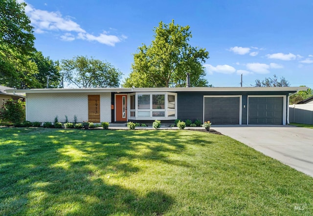 1913 W Suncrest Dr, Boise, ID 83705 - view of front of house featuring an attached garage, concrete driveway, a front lawn, and brick siding